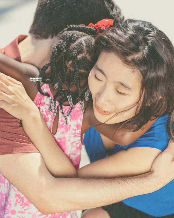 Adoptive/Foster/Kinship family hugging their child during a foster and adoption consultation session.
